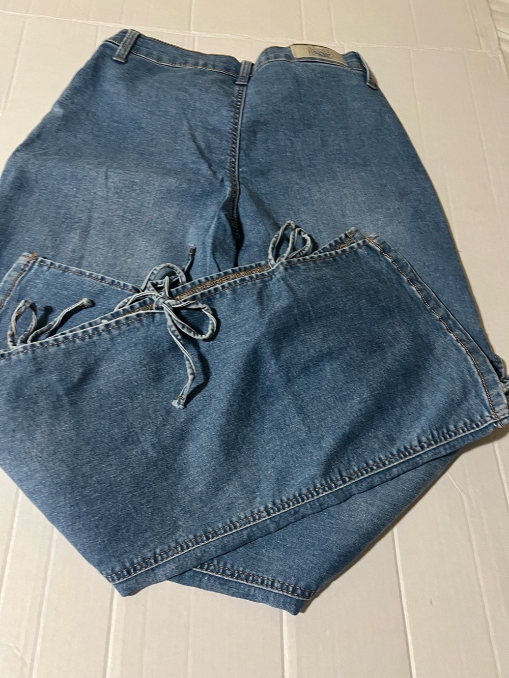 High-Rise Blue Denim Jeans with Side Tie Detail